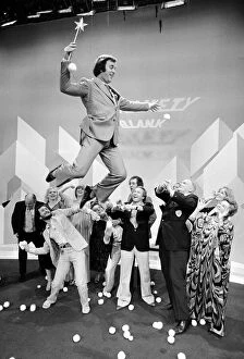 Images Dated 10th December 1979: Compere Terry Wogan takes to the air on the Special Christmas Edition of hit show