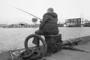 A competitor in the Daily MIrror Angling Competition at Surrey Docks, London A competitor in the Daily MIrror Angling Competition at Surrey Docks, London
