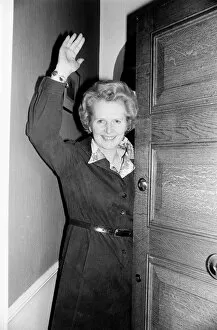 Conservative politician Margaret Thatcher waves at the front door of her home May