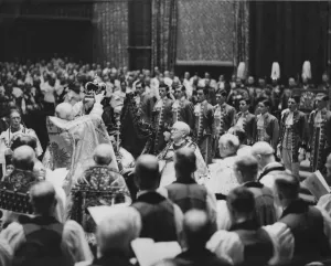 Cosmo Gordon Lang the Archbishop of Canterbury seen here placing the crown upon the head Cosmo Gordon Lang the Archbishop of Canterbury seen here placing the crown upon the head