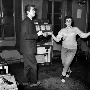 00479 Gallery: Couple dancing to music from juke box. 1960