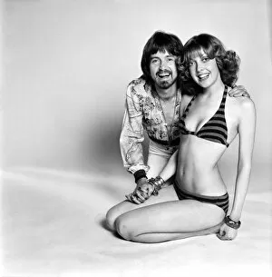 Images Dated 6th May 1975: Couple wearing 1970s fashion. The woman wearing a matched striped bikini with the man