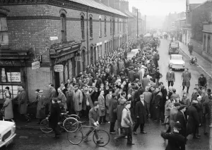 Coventry City fans queue for tickets to the second division title match against Wolves Coventry City fans queue for tickets to the second division title match against Wolves