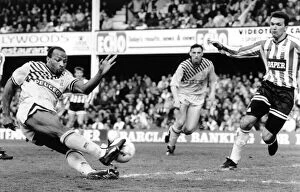 Coventry Citys player, Cyrille Regis is off target from a scoring chance as