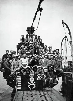 The crew of HMS Sportsman pose on the deck of their submarine at a un-named Northern The crew of HMS Sportsman pose on the deck of their submarine at a un-named Northern