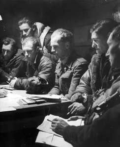 The crew of an RAF Stirling bomber interrorgated after their return from a big raid The crew of an RAF Stirling bomber interrorgated after their return from a big raid