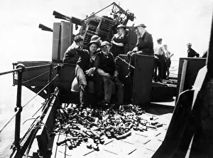 The crew of a Royal Navy destroyer's anti-aircraft gun enjoying a cigarette break The crew of a Royal Navy destroyer's anti-aircraft gun enjoying a cigarette break