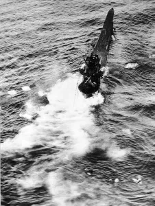 The crew of a sinking German U Boat scramble into the lifeboats after being hit by a The crew of a sinking German U Boat scramble into the lifeboats after being hit by a