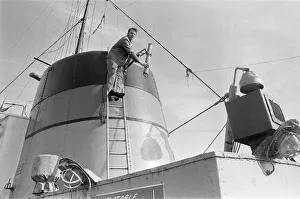 Crewman on the St Gerontius seen here repairing the ships radio antenna. 11th March 1978 Crewman on the St Gerontius seen here repairing the ships radio antenna. 11th March 1978