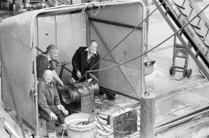 Crewmen of the Trawler Marbi Larde seen here operating a winch to unloading their catch Crewmen of the Trawler Marbi Larde seen here operating a winch to unloading their catch
