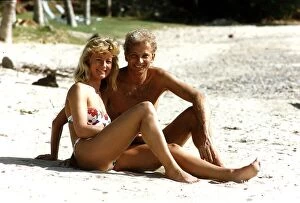 Images Dated 22nd March 1990: Cricketer David Gower cricketer with girlfriend Thorrun Nash on the beach during their