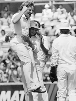 00479 Gallery: Cricketer Ian Botham celebrates with David Gower 1984 after taking his 300th Test Wicket