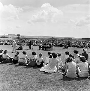 Crowds of holidaymakers watching outdoor entertainment at Butlins Holiday Camp, Filey Crowds of holidaymakers watching outdoor entertainment at Butlins Holiday Camp, Filey