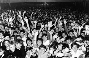 Crown of fans cheering on the Hull band Housemartins during a concert at the packed Hull