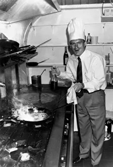 00493 Gallery: Crystal Palace manager Steve Coppell wearing chefs hat while cooking in the kitchen