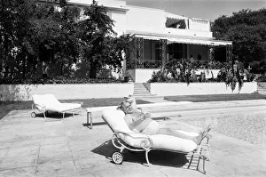Cubby Broccoli, American film producer, pictured at his Beverley Hills home, California Cubby Broccoli, American film producer, pictured at his Beverley Hills home, California