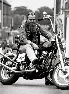 Custom Motorbikes Chopper Bike Biker Bootsy Waite sits on his Chooper motorbike Custom Motorbikes Chopper Bike Biker Bootsy Waite sits on his Chooper motorbike