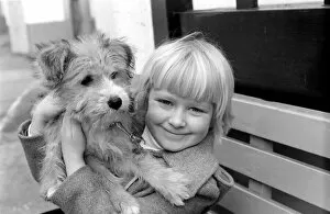 Images Dated 2nd January 1980: Cute children and Animals: Young girl holding her puppy dog. January 1980 80-00007-002