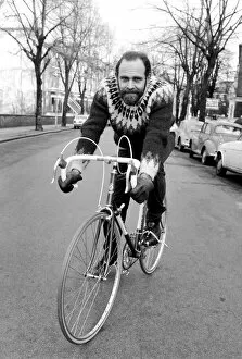 Images Dated 19th February 1975: Cycling journalist and writer Mr. Richard Ballantine riding a bicycle February