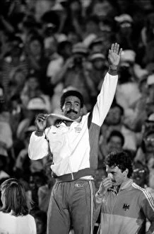 Images Dated 9th August 1984: Daley Thompson on the podium with his gold medal at the 1984 Olympics in Los Angeles