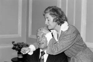 Dame Vera takes the temperature of her patient Henry Cooper. January 1976 76-00059-002 Dame Vera takes the temperature of her patient Henry Cooper. January 1976 76-00059-002