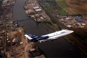 Images Dated 24th September 1996: A Dassault Falcon 20 aircraft over the River Tees and the Transporter Bridge in