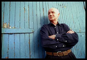 Dave Anderson actor stands at blue door June 1998 arms folded Dave Anderson actor stands at blue door June 1998 arms folded