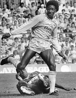 Images Dated 15th August 1987: Dave Bennett goes on the attack and leaves Spurs defender Mitchell Thomas grounded