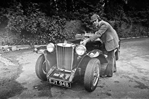 Dave Harris, 32, and his 1947 MG TC which he will be driving to Le Mans to see the famous Dave Harris, 32, and his 1947 MG TC which he will be driving to Le Mans to see the famous