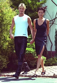 Images Dated 2nd July 1999: David Beckham Victoria Adams Posh Spice holding hands 1999 outside their home two days