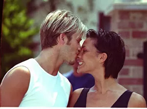 Images Dated 2nd July 1999: David Beckham and Victoria Adams Posh Spice kissing 1999 outside their home two days
