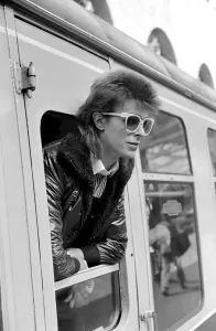 David Bowie leaning out of a railway carriage of the Paris boat train at Victoria station David Bowie leaning out of a railway carriage of the Paris boat train at Victoria station