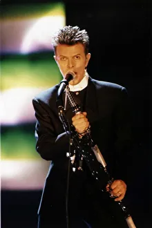 David Bowie Singer Songwriter at the Brit Awards 96 Wearing black suit singing David Bowie Singer Songwriter at the Brit Awards 96 Wearing black suit singing