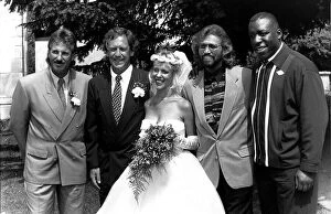 David English and his bride Robyn pose for the cameras with his best man Ian Botham