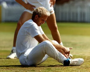 Images Dated 22nd August 1990: David Gower cricketer sitting on the grass, August 1990