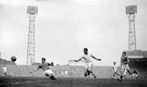 David herd of Arsenal gets in a shot at goal past the challenge of Manchester United David herd of Arsenal gets in a shot at goal past the challenge of Manchester United