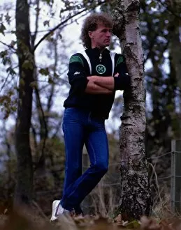 Davie Provan leans on tree in garden November 1986