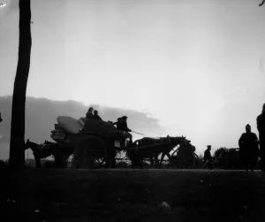 Dawn breaks on the Antwerp road revealing a line of refugees making for the city ahead of Dawn breaks on the Antwerp road revealing a line of refugees making for the city ahead of