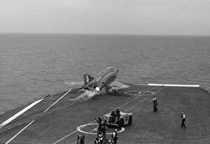 The deck crew on board HMS Ark Royal protect their ears as a McDonnell Douglas Phantom The deck crew on board HMS Ark Royal protect their ears as a McDonnell Douglas Phantom