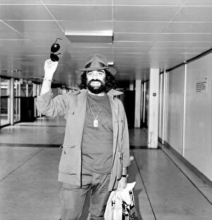Images Dated 2nd February 1981: Demis Roussos leaving Heathrow Airport for Abu Dhabi. He is with a show