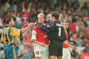 Images Dated 23rd September 1995: Dennis Bergkamp is congratulated by Arsenal goalkeeper David Seaman as they celebrate