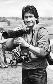 Images Dated 8th August 1979: Dennis Mortimer, Aston Villa captain when they won the European Cup. Holding a camera