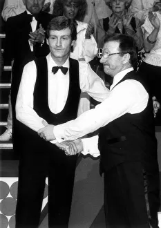 Dennis Taylor comiserates Steve Davis after winning the Embassy Snooker World Dennis Taylor comiserates Steve Davis after winning the Embassy Snooker World