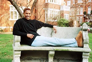Denzel Washington Actor sitting on a bench Denzel Washington Actor sitting on a bench