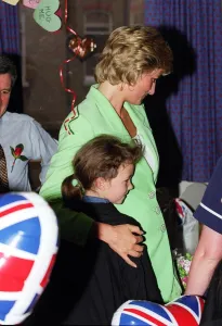 Diana, Princess of Wales with her arm round Danielle Stephenson on a visit to a Diana, Princess of Wales with her arm round Danielle Stephenson on a visit to a