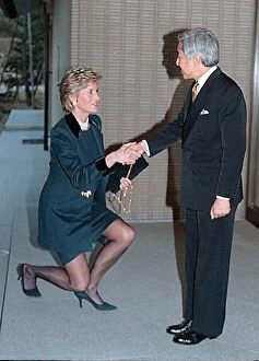 Images Dated 8th February 1995: Diana, Princess of Wales curtsies as she greets Emperor Akihito of Japan during her visit