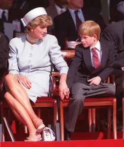 Diana Princess of Wales holding the hand of her son Prince Harry at a ceremony in Hyde Diana Princess of Wales holding the hand of her son Prince Harry at a ceremony in Hyde
