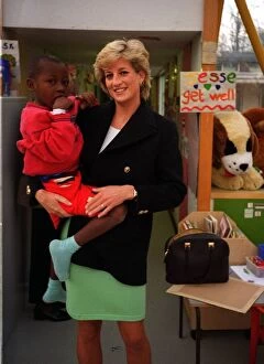Images Dated 1st April 1996: Diana, Princess of Wales, with seven year old Arnaud Wambo from Cameroon