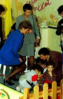 Images Dated 28th November 1994: Diana Princess of Wales visits the Enfant Present Creche in Paris during her one day
