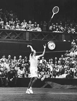 Dick Savitt throws racket in air after winning the 1951 mens singles final against Ken